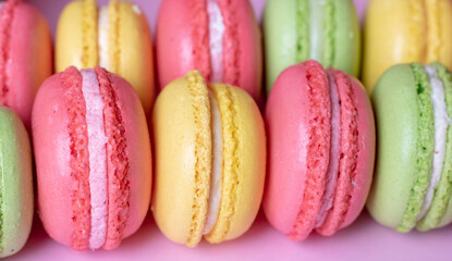 Many tasty macarons background, close up. French concept