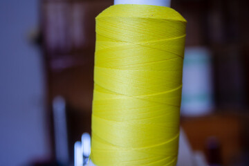 Close-Up Of Thread Spools for sewing machine