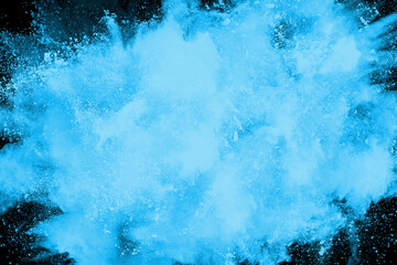 abstract blue powder splatted background,Freeze motion of color powder exploding/throwing color powder,color glitter texture on black background.