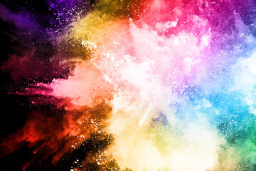abstract colored dust explosion on a black background.abstract powder splatted background,Freeze motion of color powder exploding/throwing color powder, multicolored glitter texture.