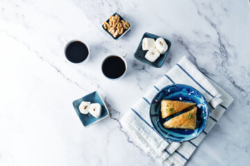Turkish delight. Baklava and coconut lukum with cups of coffee