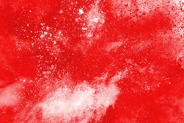 Freeze motion of red powder exploding, isolated on white background. Abstract design of red dust cloud. Particles explosion screen saver, wallpaper