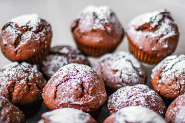 homemade cupcakes and muffins with chocolate toppings and decorations