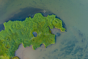 Drone bird's eye view landscape image of tidal wetlands in Christchurch Harbour on England's South Coast