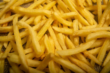French fries scattered surface texture. Close up.
