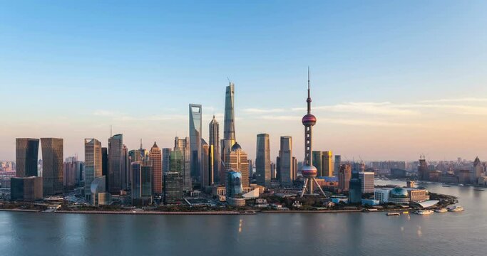 dusk scene in shanghai, time lapse of beautiful pudong financial center and huangpu river in sunset, China.