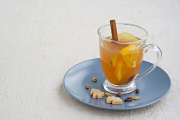 Apple cider with spices. Alcoholic or non-alcoholic hot drink made from fresh unfiltered apple juice with spices, apple slices and orange