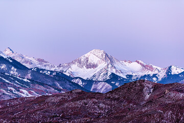 Aspen, Colorado colorful purple pink blue sunrise twilight with Capitol Mt Daly Snowmass mountain...
