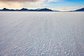  Bonneville Salt Flats wide angle view of texture at foreground and storm clouds near Salt Lake City, Utah and mountain view during sunset with nobody open landscape © Andriy Blokhin