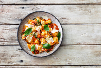 Italian ravioli with tomato sauce and parmesan cheese