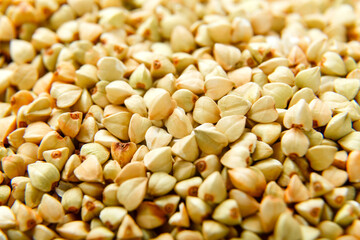 Green buckwheat scattered on the surface macro shot.