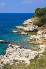 Blue sea and rocky shore in Corfu, Greece