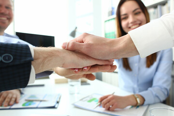 Group of people in suits crossed hands in pile for win closeup. White collar leadership high five cooperation initiative achievement corporate life style friendship dea, heap stack concept