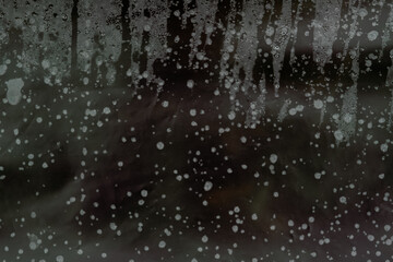 Fototapeta na wymiar rain drops on window. misted glass. condensate in a greenhouse