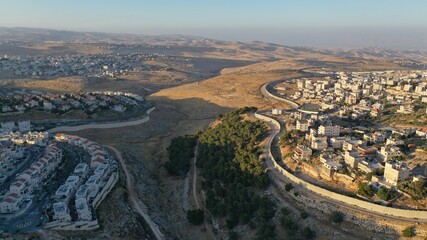 Israel and Palestine divided by Security wall Aerial view
Aerial view of Left side Anata Palestinian town and Israeli neighbourhood Pisgat zeev  
