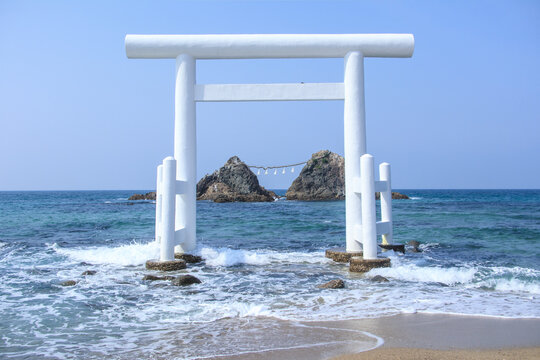 Meotoiwa and White Torii gate near the sea at Sakurai Futamigaura Itoshima, Fukuoka Prefecture, Japan