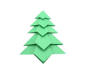 Obraz premium Green origami christmas tree isolated on white background