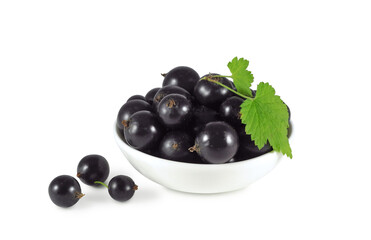 Ripe black currant with leaves in ceramic bowl isolated on white background	
