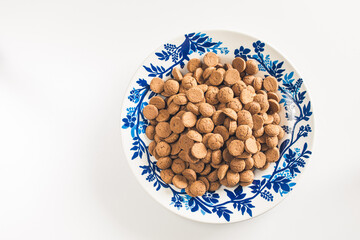 White plate with decorative blue rim, filled with tasty baked goods.