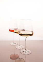 Three glasses of different white and rose wines