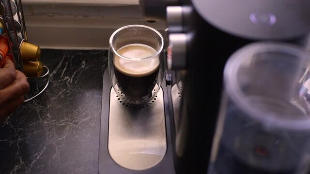 Espresso coffee being made in kitchen