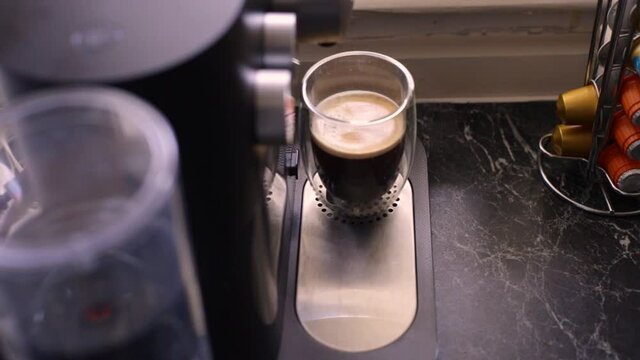 Espresso coffee being made in kitchen