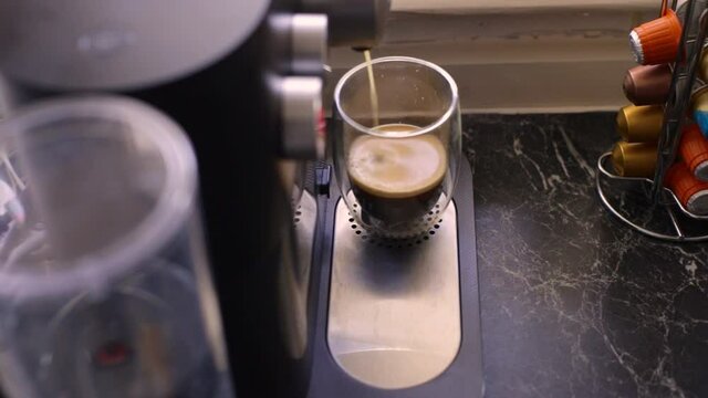 Espresso coffee being made in kitchen
