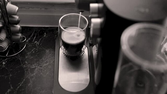 Espresso coffee being made in kitchen