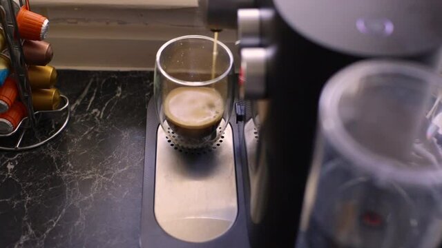 Espresso coffee being made in kitchen