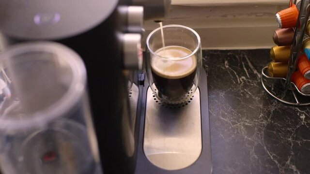 Espresso coffee being made in kitchen