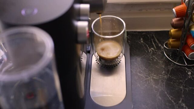 Espresso coffee being made in kitchen