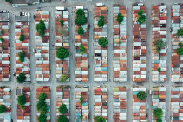 An aerial view of the pattern of abandoned containers before the auction sale of the containers blindly. Drone shot.