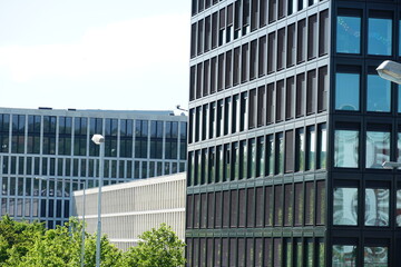 Several corporate buildings with modern facades highly concentrated in a business park.