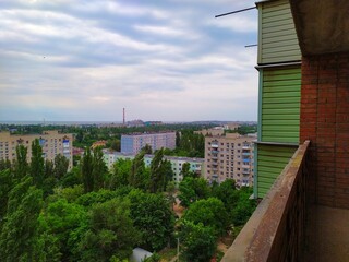 View of the city in summer from a high balcony