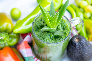 Cup of smoothie with it is ingredients around it