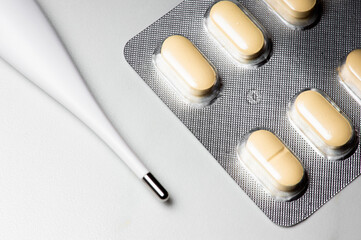 pills and capsules with thermometer