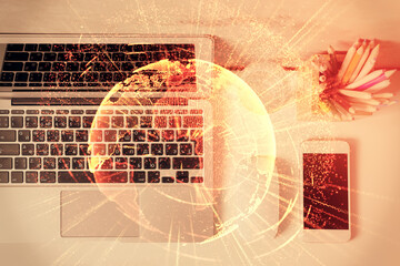 Social network hologram drawings over computer on the desktop background. Top view. Multi exposure. Concept of people connection.