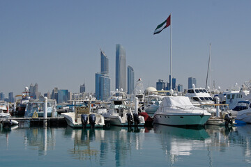 Modern skyscrapers form a backdrop to the busy marina in Abu Dhabi City, United Arab Emirates.
