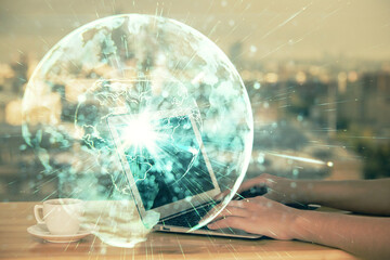 Multi exposure of woman hands typing on computer and business theme hologram drawing. Success concept.
