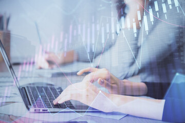 Multi exposure of woman hands typing on computer and financial chart hologram drawing. Stock market analysis concept.
