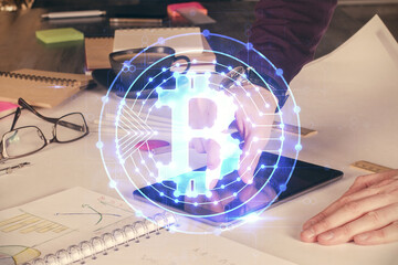 Double exposure of man's hands holding and using a phone and crypto currency blockchain theme drawing.