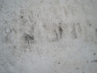 Close-up photo of a dirty concrete floor