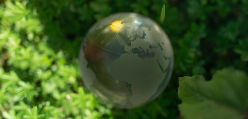 Obraz na płótnie Canvas green earth concept glass sphere.