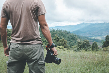 male traveler photographer fascinated by illuminated nature mountains