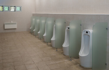 Row of urinals in restroom