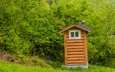 Public restroom built to look like a small log cabin