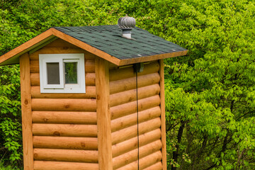 Public restroom built to look like a small log cabin