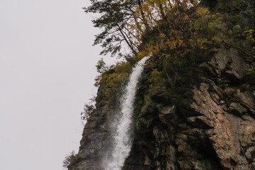 Waterfall cascading over a rocky ledge