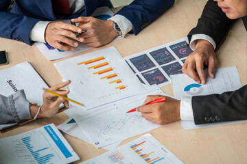 Smart businessman and businesswoman talking discussion in group meeting at office table in a modern...