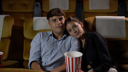 People audience watching movie in the movie theater cinema. Group recreation activity and...